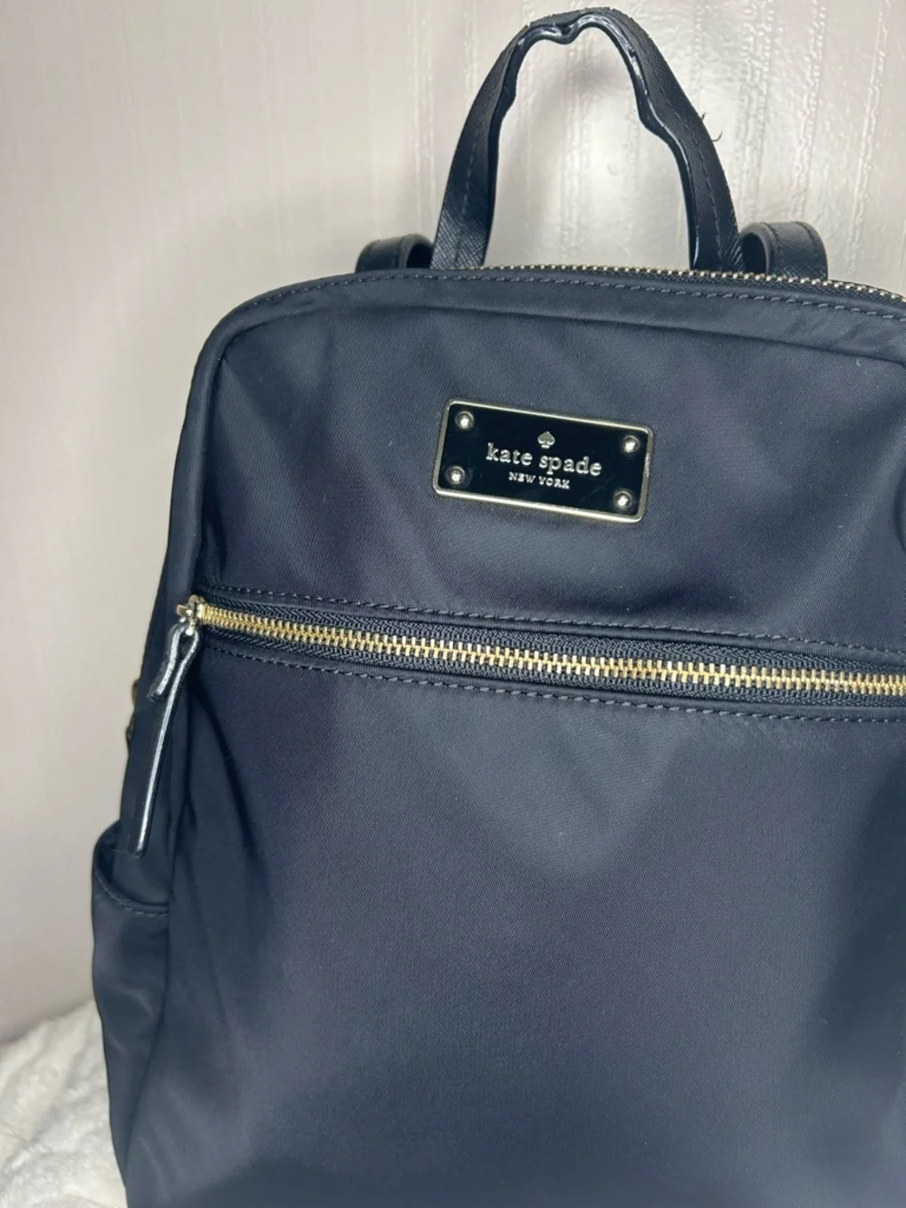Kate Spade Blake Ave black nylon mini backpack with gold hardware